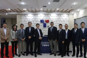 Г-н Хироюки, научно-исследовательские и развитие главы Hitachi Group посетили Xi'an Tianlong